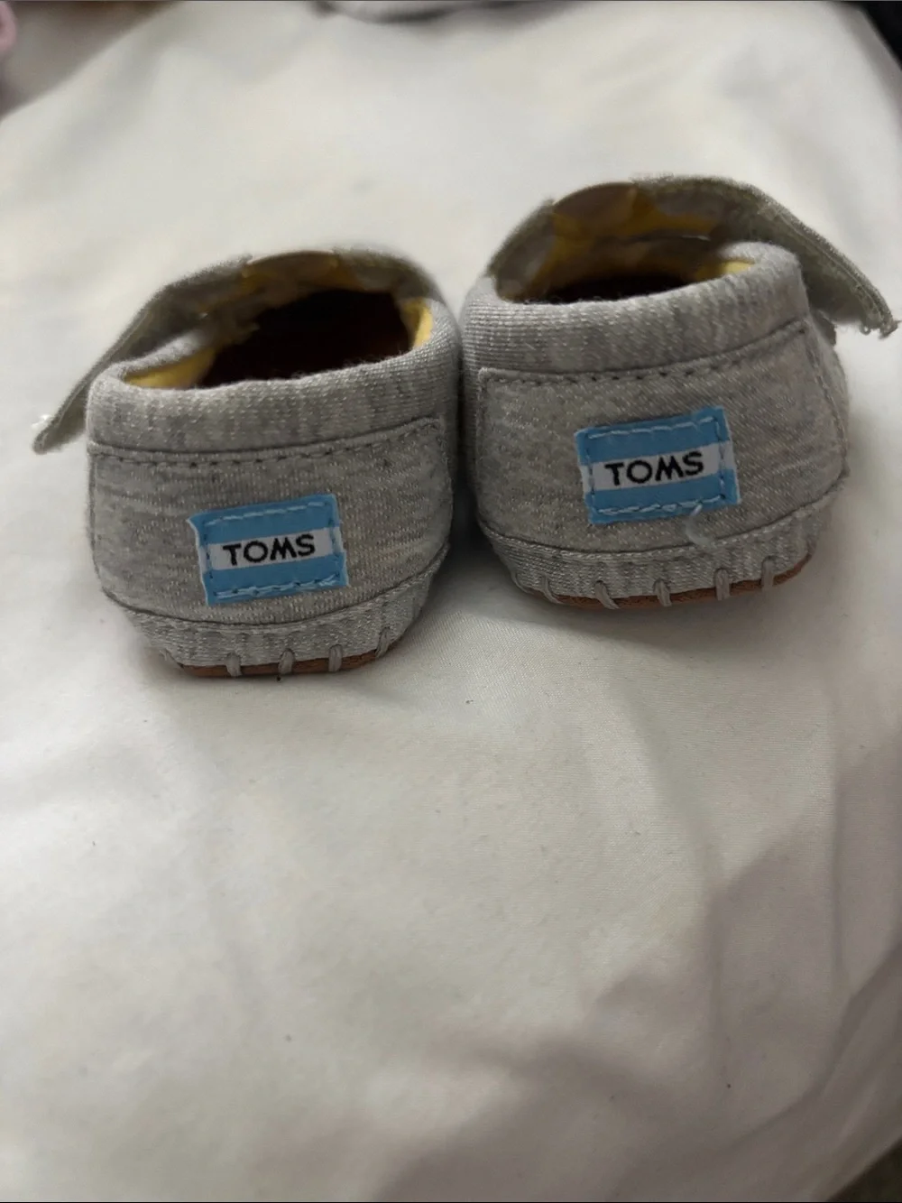 Toms Baby Gray Slip-On Shoes with Yellow Lining